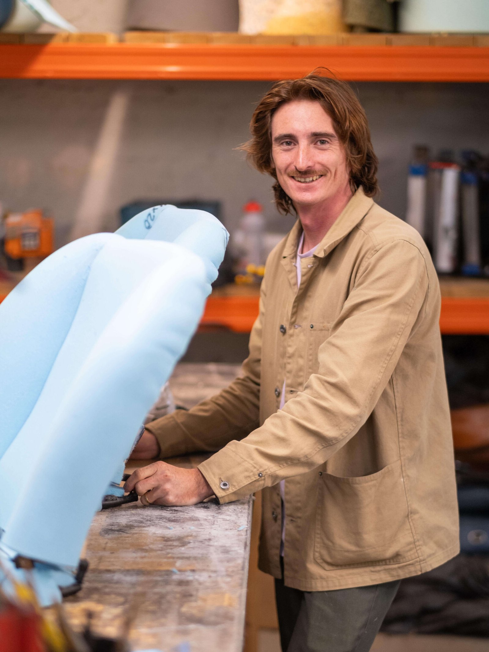 Greg, founder of Classic Car Experts, working in his classic car trimming workshop.